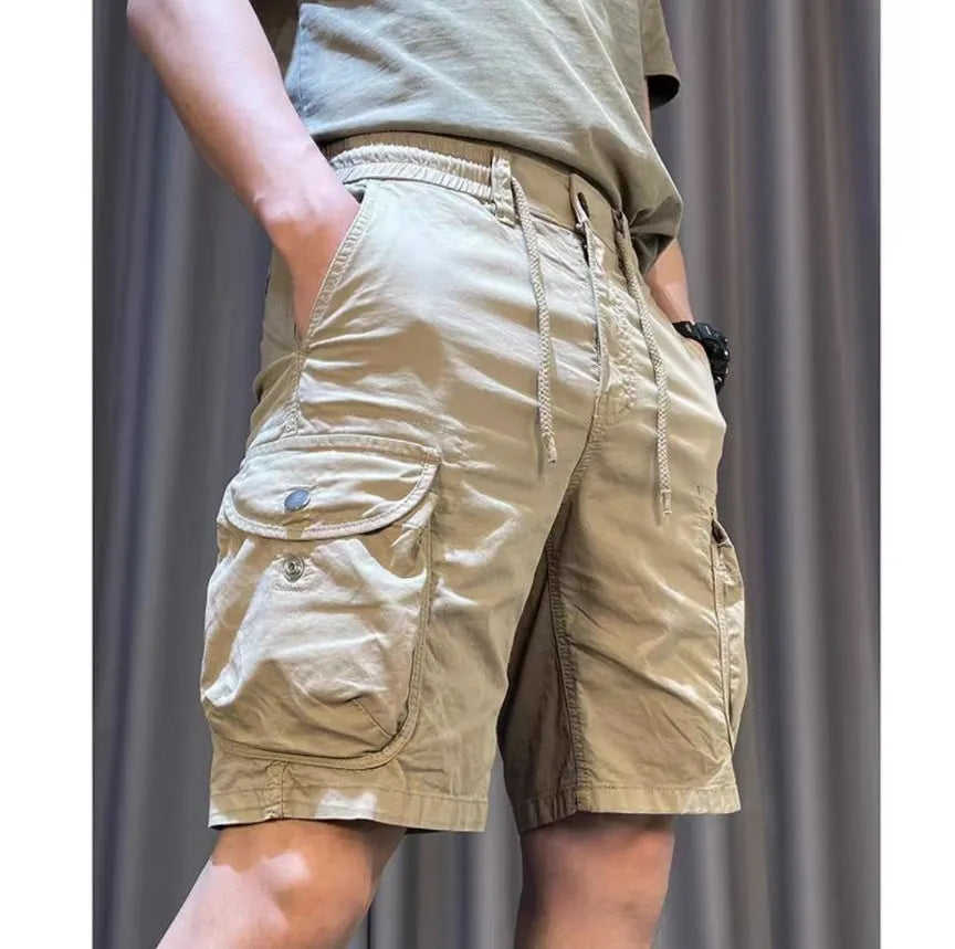 Loose straight multi-pocket casual overalls pants in black, grey, green, or khaki with a relaxed fit and five pockets.