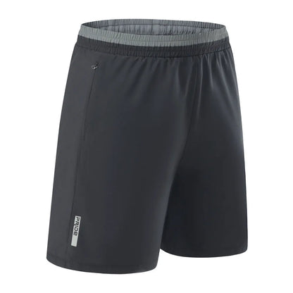 Men's loose grey ice silk cropped running pants showing the fifth pants length and relaxed fit.
