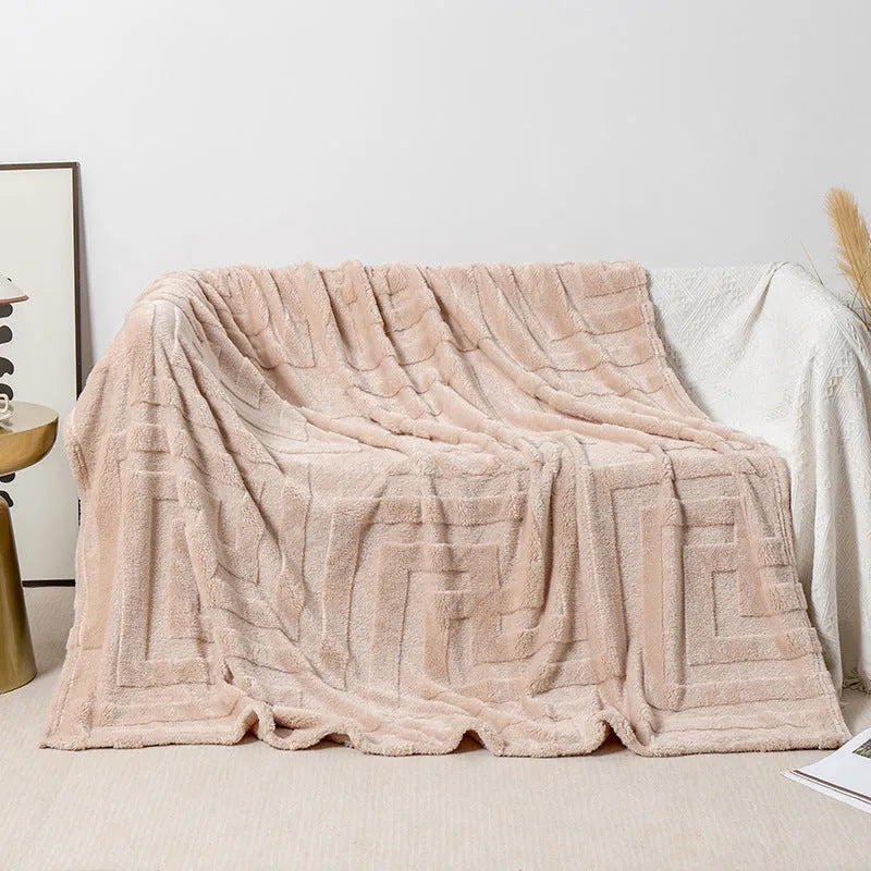 Thick square coral fleece blanket in a modern style, shown in one of five colours including lake blue or khaki.