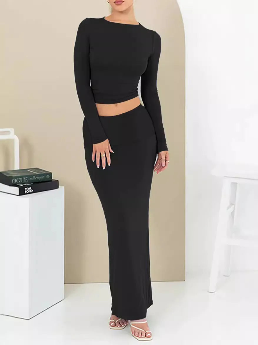 Women's black polyester two-piece suit with a sweet style, featuring a top and long skirt in a slim fit.