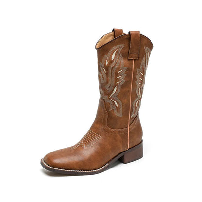 Brown women's mid-calf Martin boots with embroidered detail on the shaft.