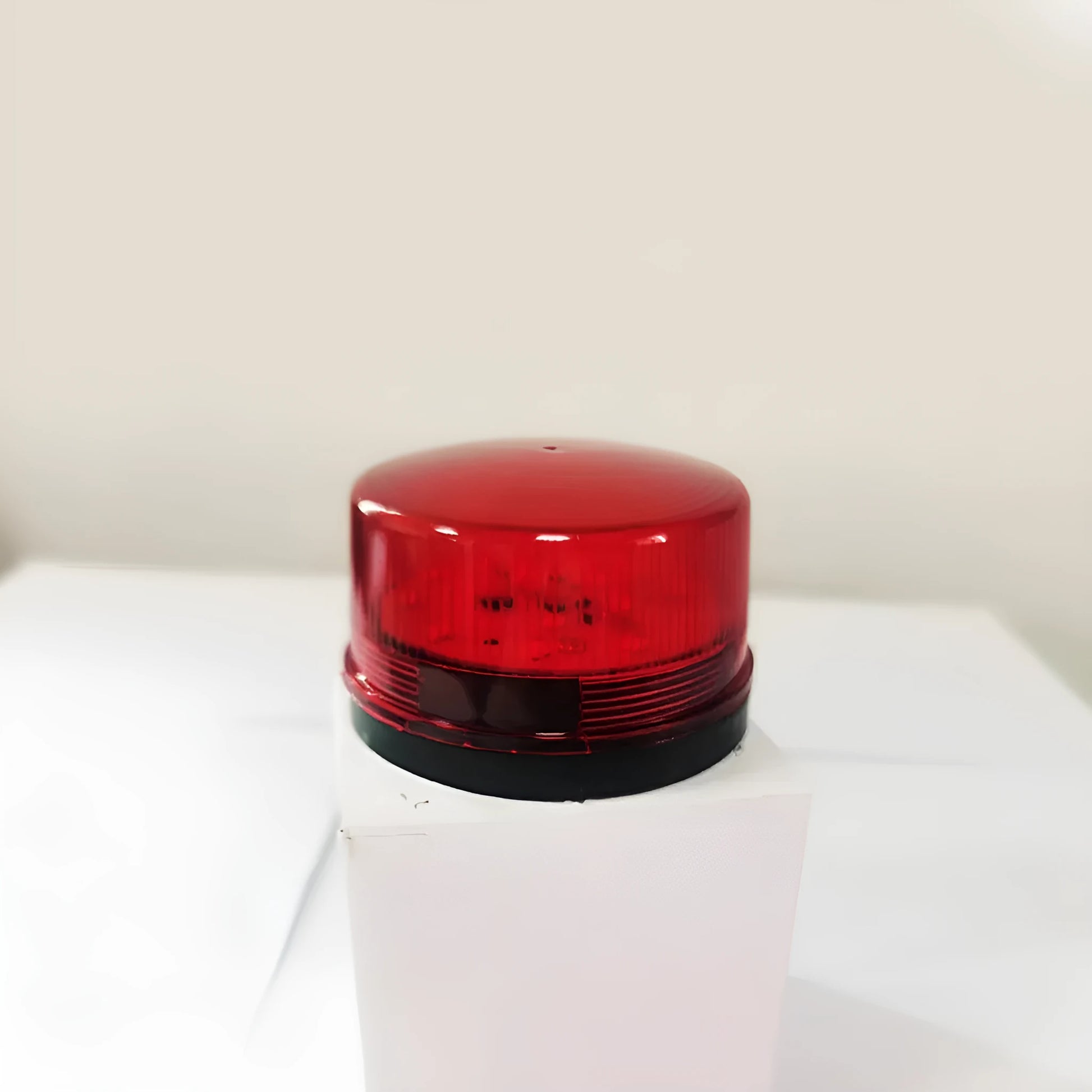 Small Flash 24v warning light showing 73mm diameter, 45mm height with red housing and mounting base