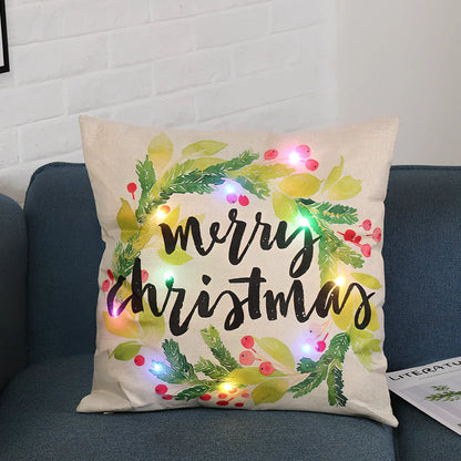 45cm square Christmas cushion with linen cover and battery-operated lighting showing festive design