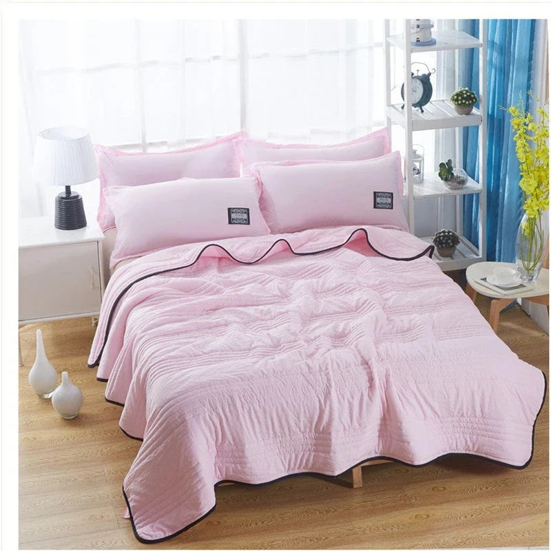 Lightweight, breathable cooling comforter in various colors and sizes for summer sleep comfort