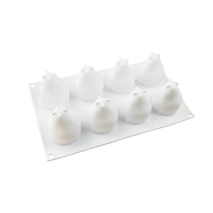Flexible blue silicone baking mould with six detailed pineapple and pine cone shaped cavities