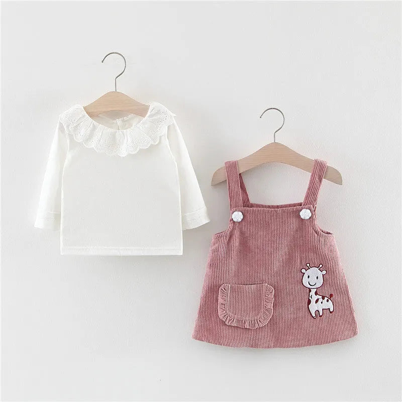 Baby girl two-piece cotton dress set with long-sleeve top and suspender skirt in yellow or pink.