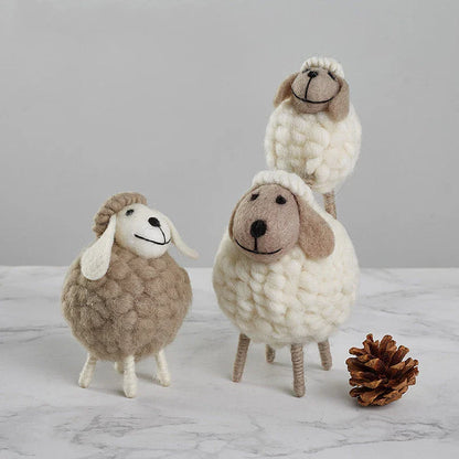 Adorable plush sheep decorations in various sizes and color combinations, perfect for adding a cozy, farmhouse-inspired touch to any home.