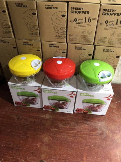 Manual vegetable fruit shredder with stainless steel blade on kitchen counter