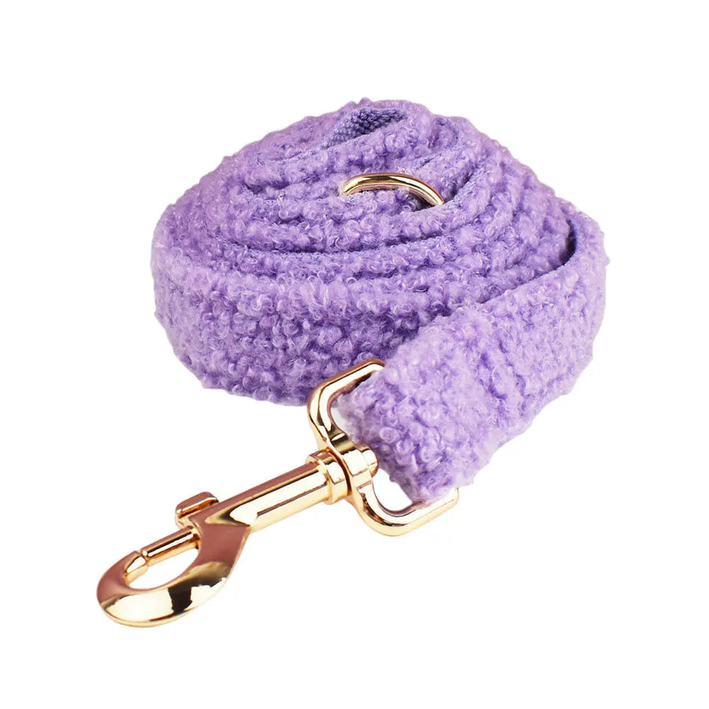 Cloth dog accessory set showing collar, leash, bow, and vest in coordinating fabric