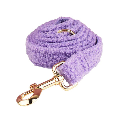 Cloth dog accessory set showing collar, leash, bow, and vest in coordinating fabric