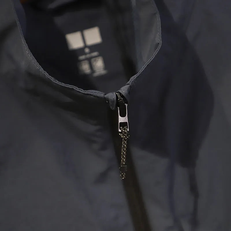 Men's navy blue quick-dry nylon vest cardigan with side pockets on a hanger