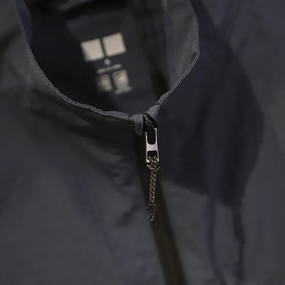 Men's navy blue quick-dry nylon vest cardigan with side pockets on a hanger