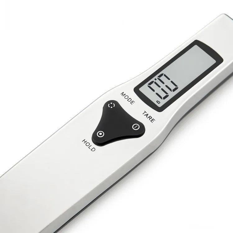 Smart digital measuring spoon with built-in electronic scale, featuring a 0-30ml spoon volume capacity and precise weighing from 0.1g to either 300g or 500g, powered by two included AAA batteries, for accurate ingredient measurement in cooking and baking.