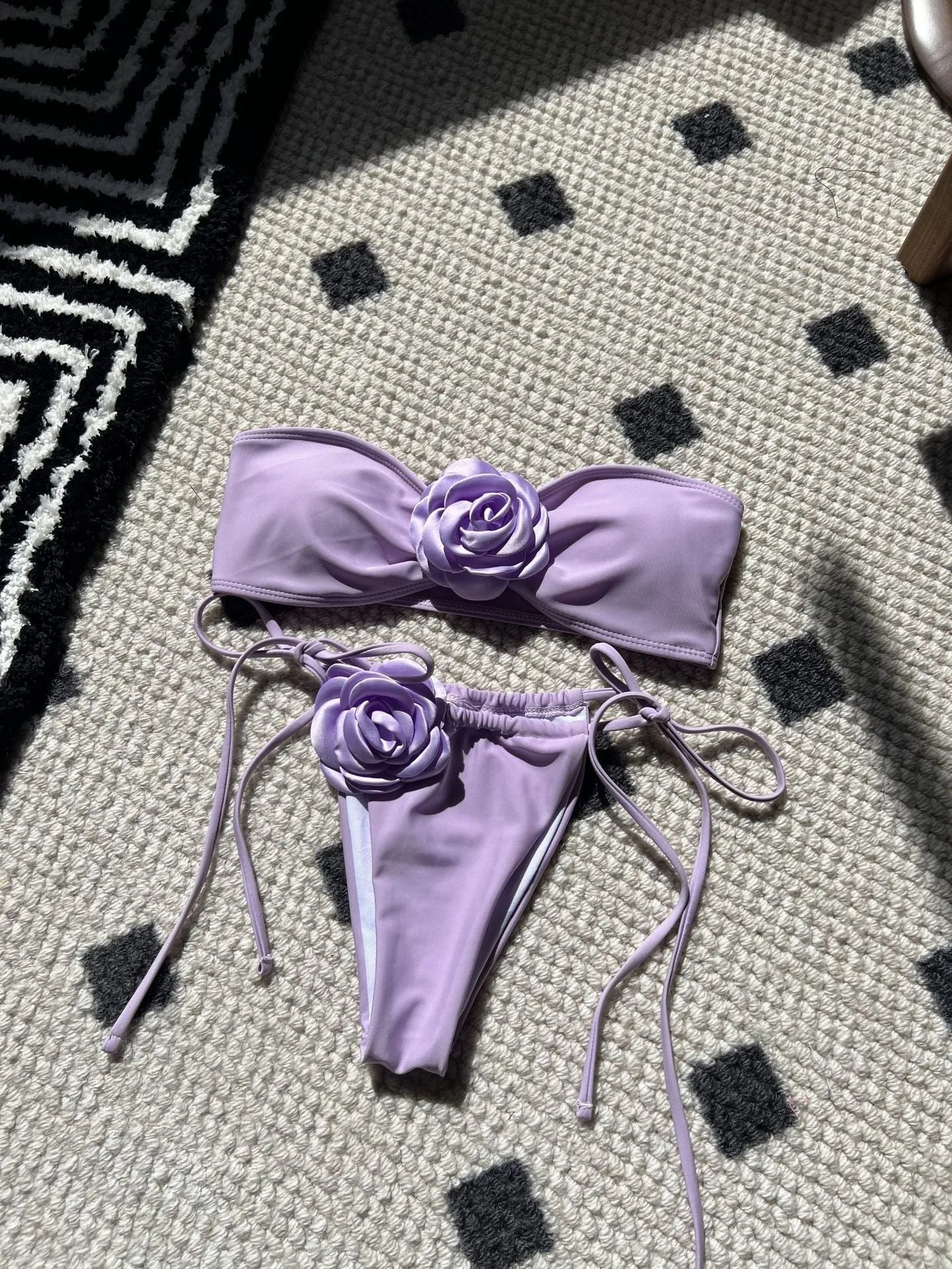 Women's adjustable drawstring tube top swimsuit with high-cut briefs in a solid colour.