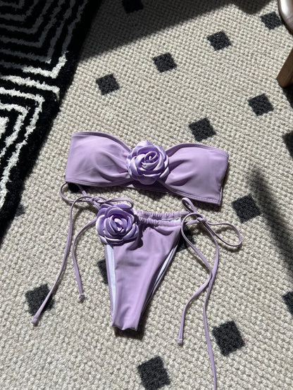 Women's adjustable drawstring tube top swimsuit with high-cut briefs in a solid colour.