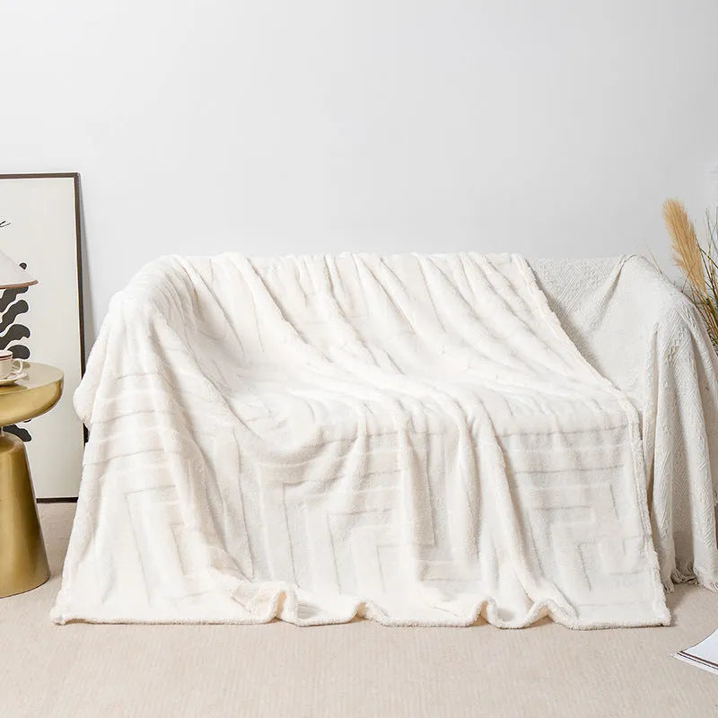 Thick square coral fleece blanket in a modern style, shown in one of five colours including lake blue or khaki.