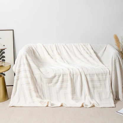 Thick square coral fleece blanket in a modern style, shown in one of five colours including lake blue or khaki.