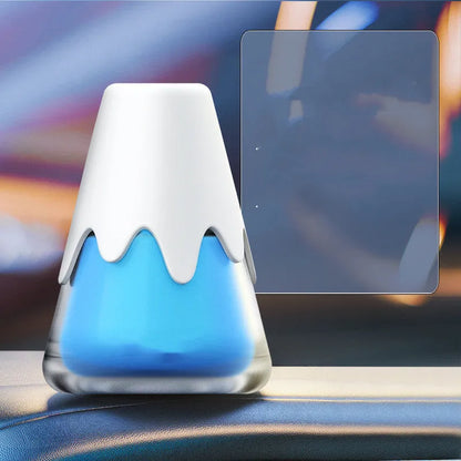 Glass-cased car aromatherapy unit with solid fragrance cream, shown in purple colour variant.