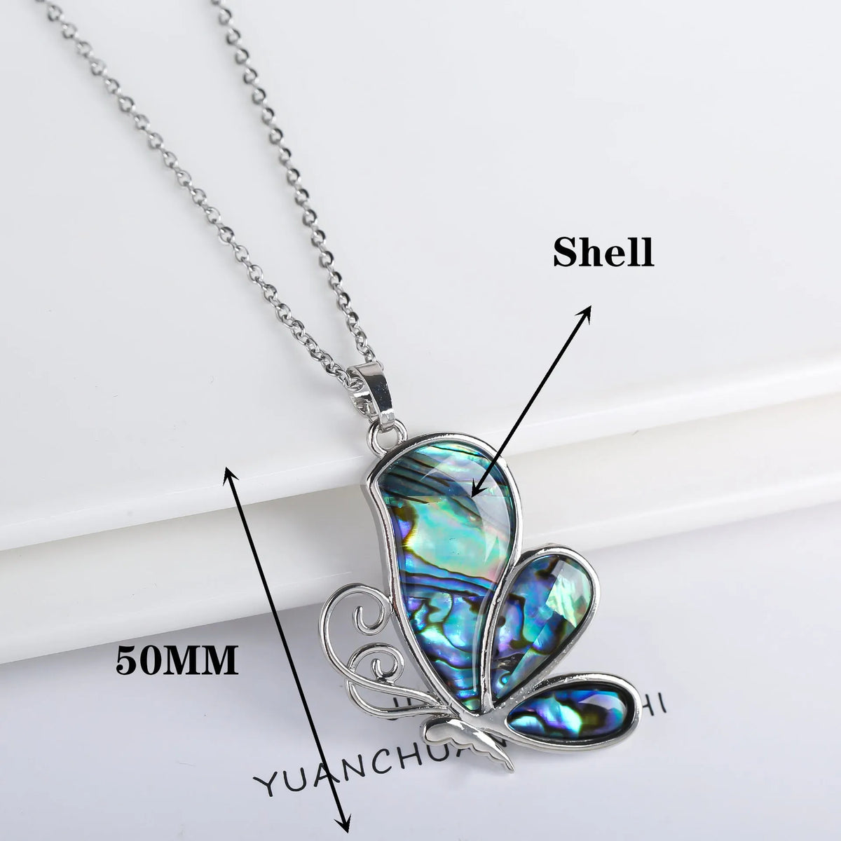 Abalone shell pendant necklace with copper electroplated animal zodiac design and butterfly or dragonfly detail