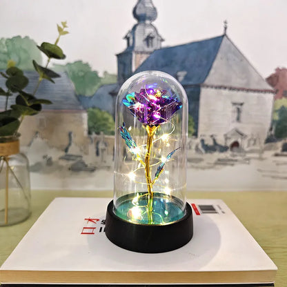 Glass cover small night lamp with plastic flowers, 15cm height, black base, showing colour light options