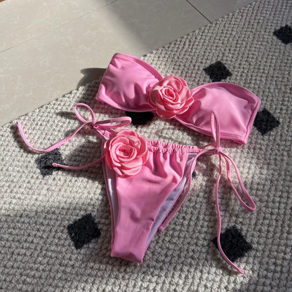Women's adjustable drawstring tube top swimsuit with high-cut briefs in a solid colour.