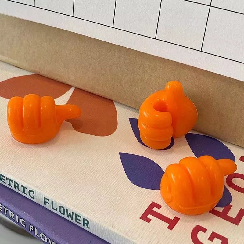 Silicone thumb wall hooks in various colors for organizing kitchen and bathroom items