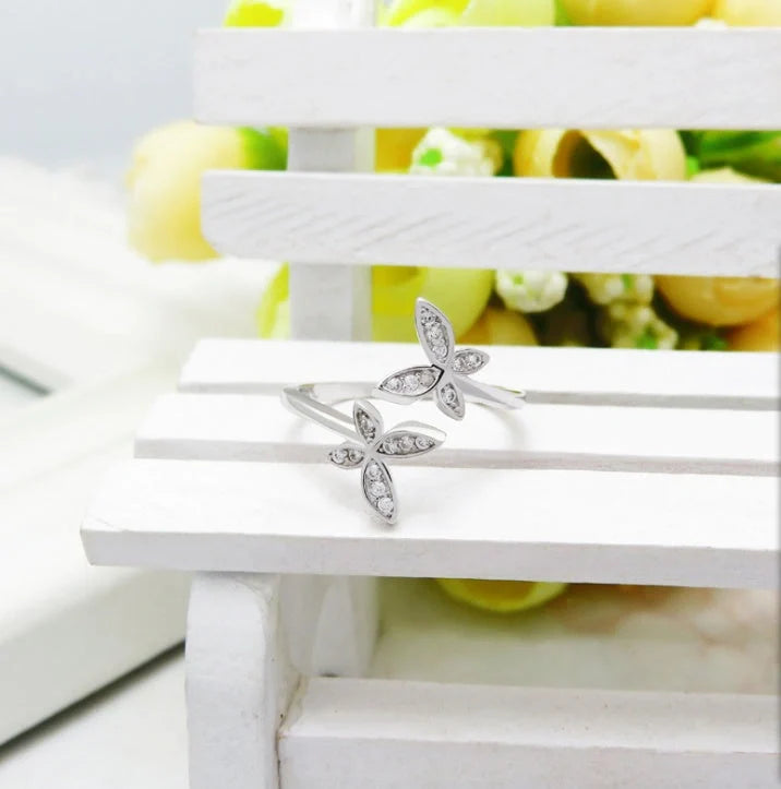 Adjustable sterling silver ring with intricate butterfly design, ideal for everyday wear or special occasions.