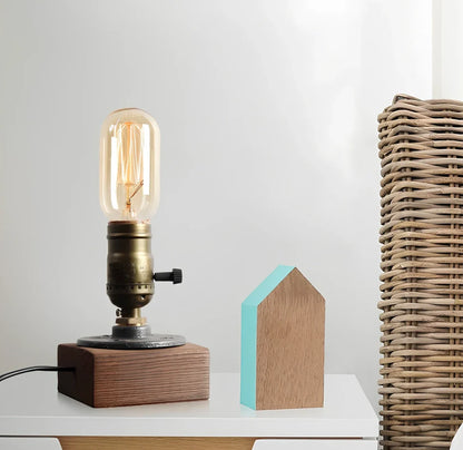 Water pipe table lamp with wood and iron construction measuring 9cm wide by 13cm tall