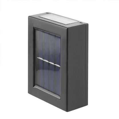 Solar garden wall light with LED illumination measuring 30×75×100mm in black plastic finish