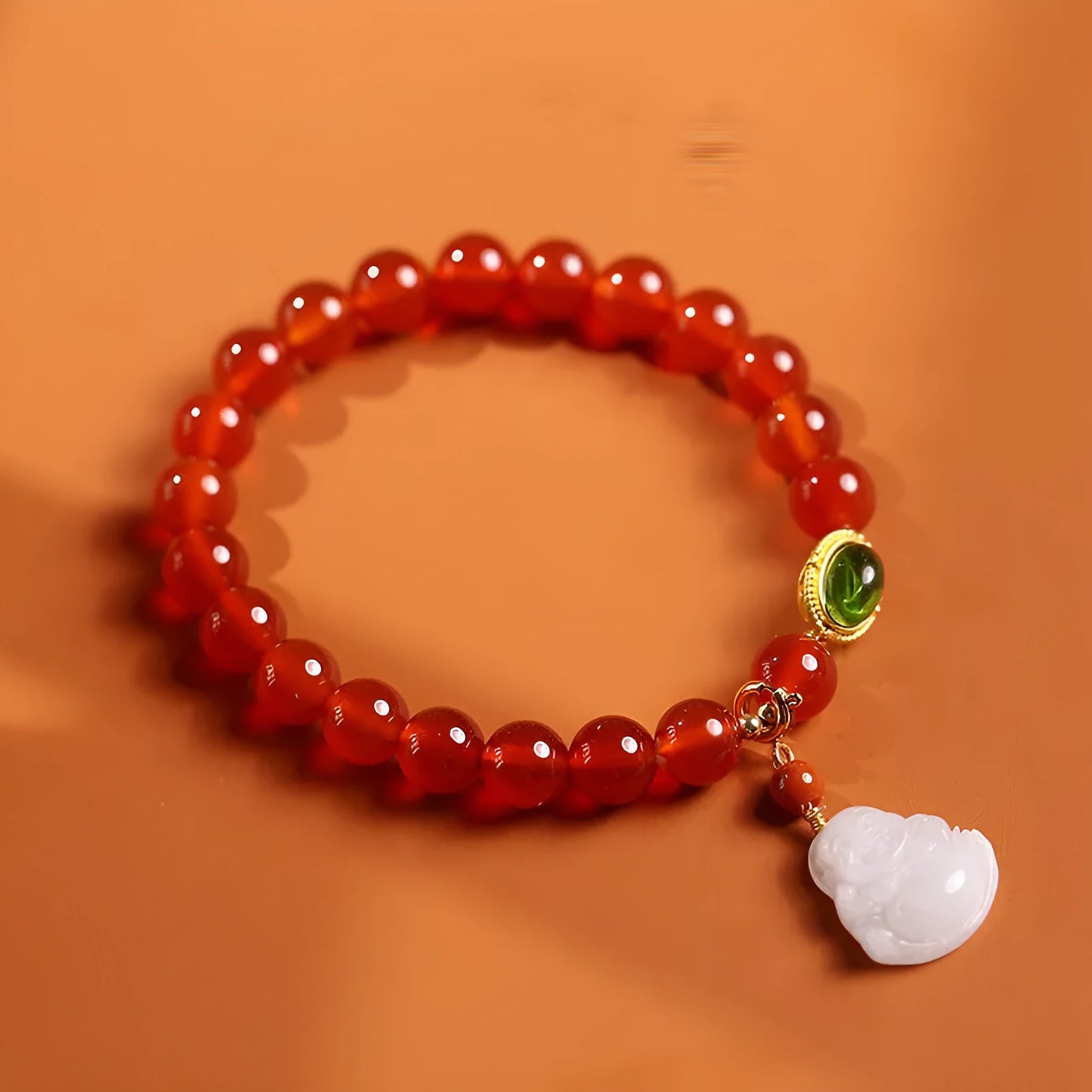 Handcrafted red agate bracelet with amber beads, jade accents, and Maitreya Buddha pendant in Chinese geometric style