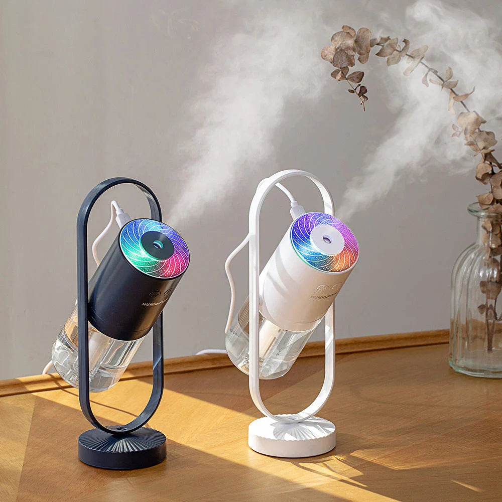 Compact desktop humidifier with starry projection feature, designed to improve air moisture and create a relaxing ambiance.