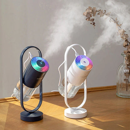 Compact desktop humidifier with starry projection feature, designed to improve air moisture and create a relaxing ambiance.
