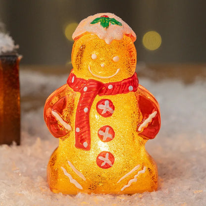 Glowing gingerbread man Christmas ornament measuring 6.5cm wide with LED lights and red scarf