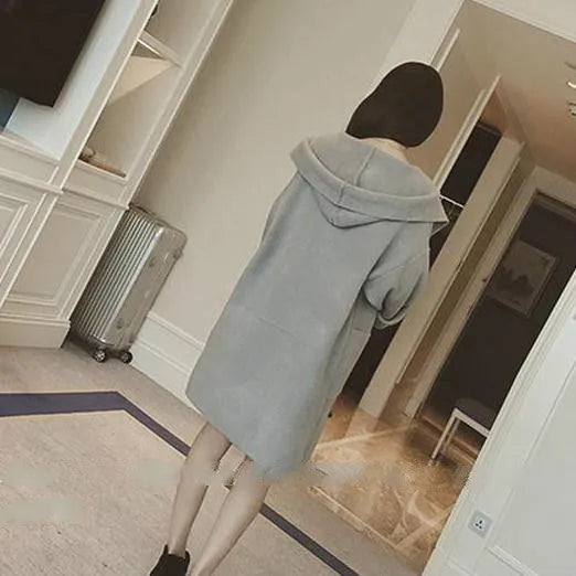 Plus size woman wearing a grey thin cotton coat with lace details, loose fit, long sleeves.