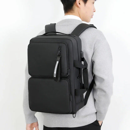 Versatile business laptop backpack with large capacity, USB charging port, and stylish design in gray and black colors