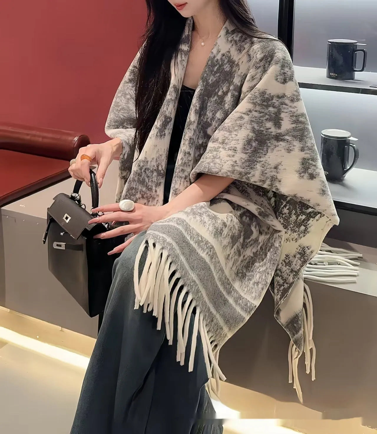Women's polyester tassel scarf cape in free-size design showing 15 cm fringe detailing and shawl-style drape