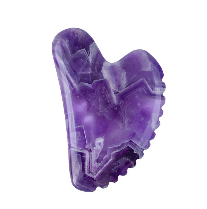 Amethyst facial roller set with heart-shaped gua sha and claw massage tools on white background