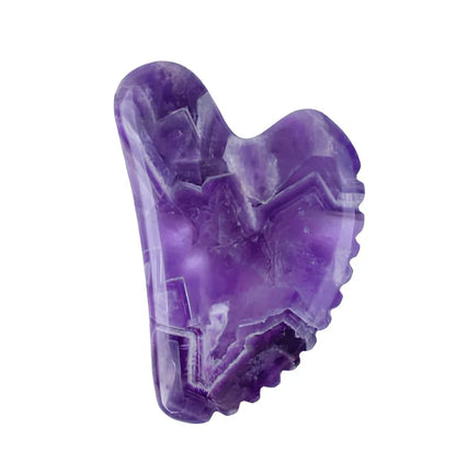 Amethyst facial roller set with heart-shaped gua sha and claw massage tools on white background