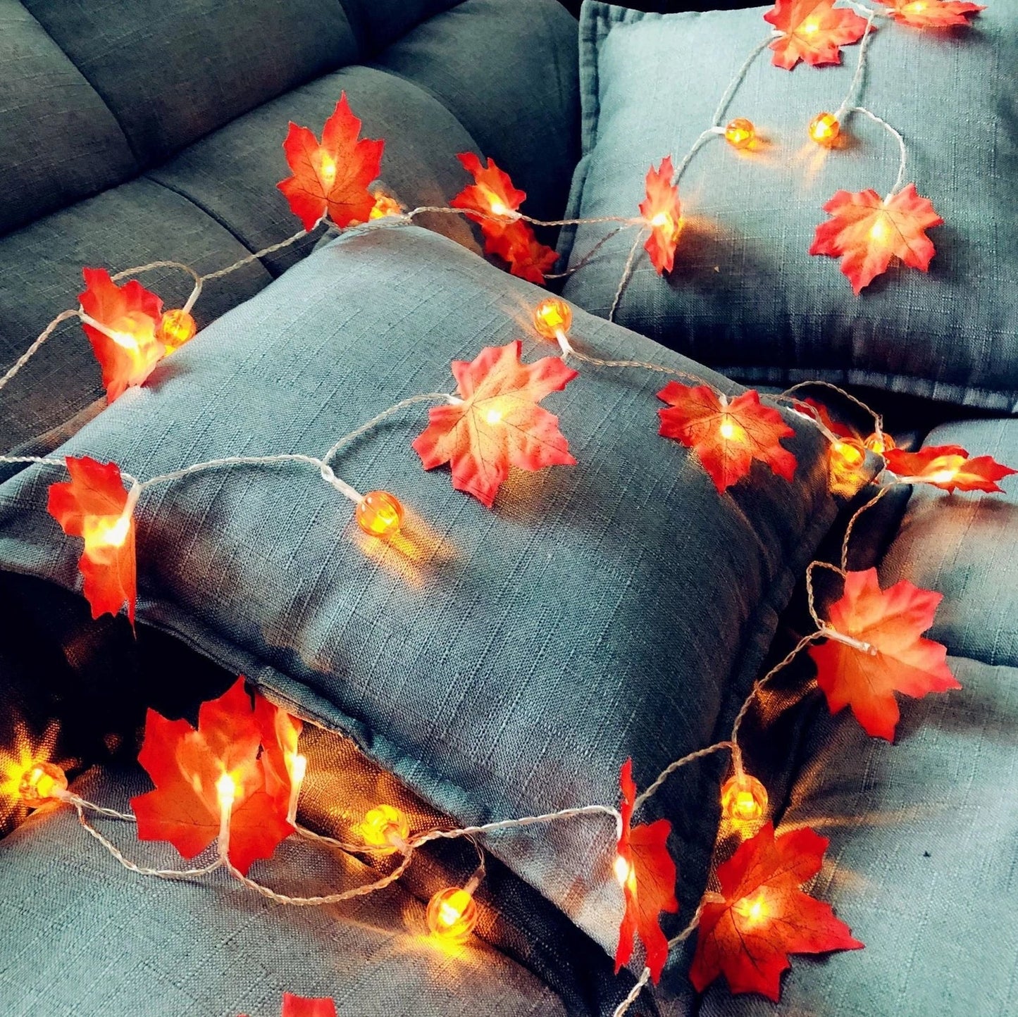 Halloween pumpkin light string with orange plastic pumpkins and warm white LED illumination