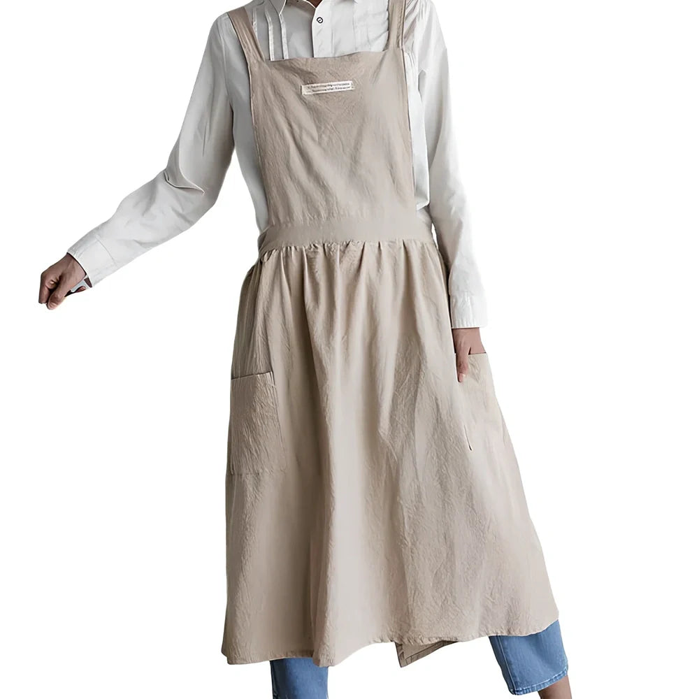 Sleeveless cotton kitchen apron in blue colour showing front coverage and adjustable neck strap