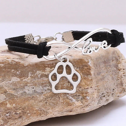 Hand-woven Infinite Love Pet Bracelet in various colors, showcasing the bow shape and alloy material.