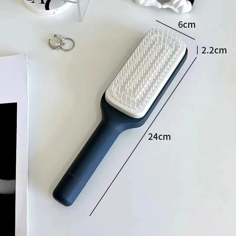 Roland Purple self-cleaning hair brush with rotating telescopic handle and anti-static bristles.