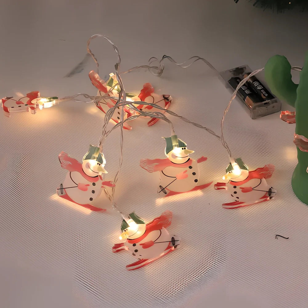 Battery-operated LED snowman Christmas lights with dotted, suit, and skiing snowman designs