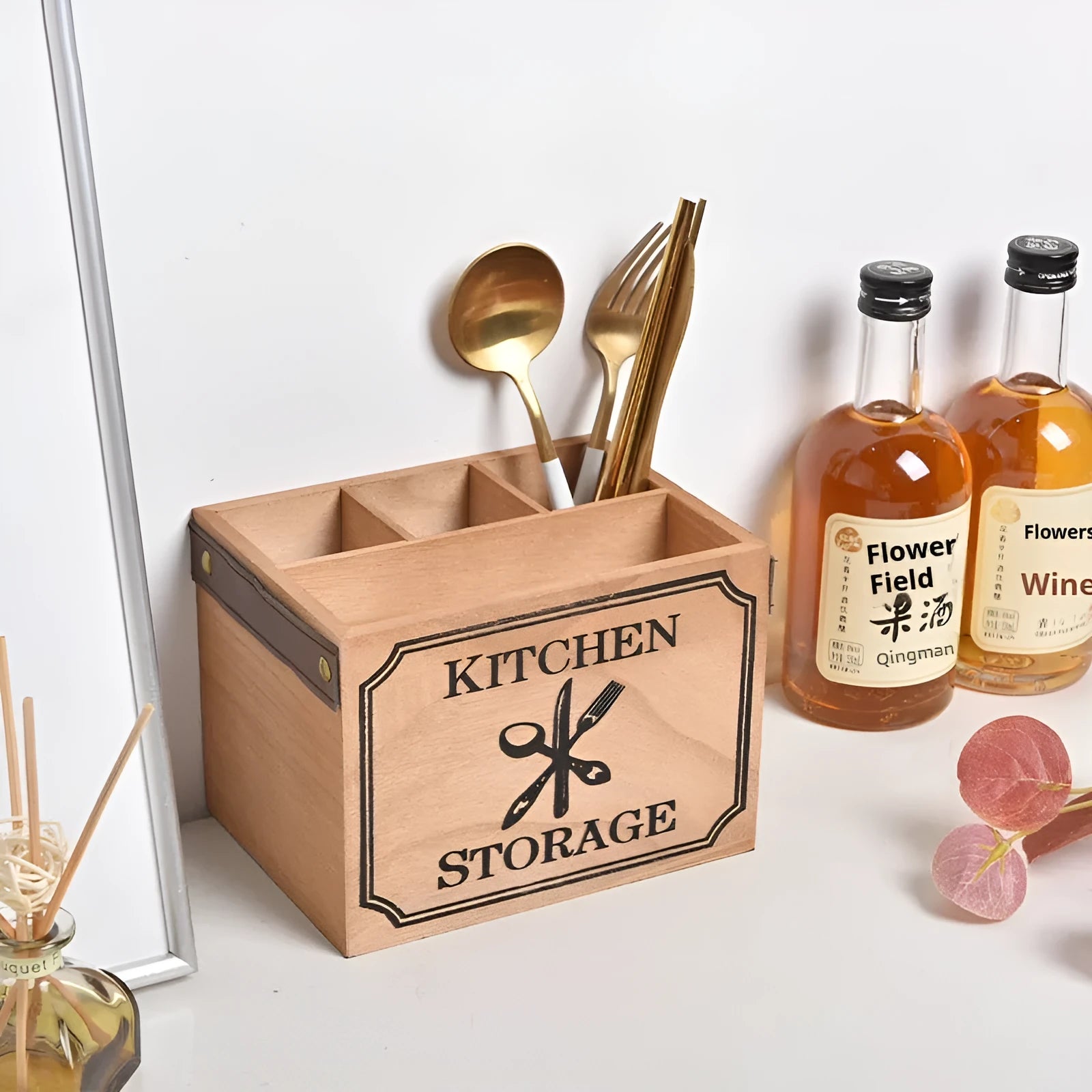Solid wood kitchen storage box with internal grid divider for organising cutlery and chopsticks.