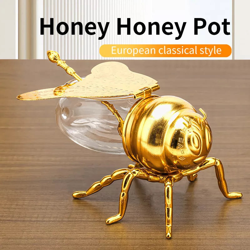 Bee-shaped honey jar with spoon, perfect for kitchen condiment storage