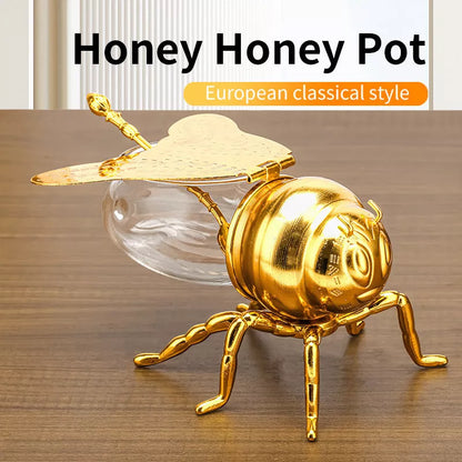 Bee-shaped honey jar with spoon, perfect for kitchen condiment storage