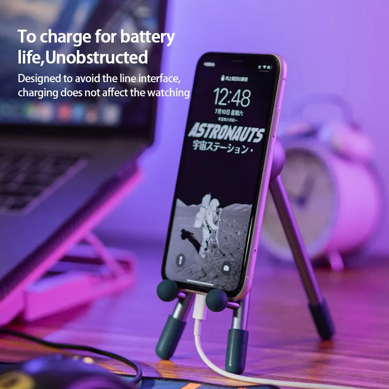 Aluminium alloy desktop phone and tablet stand with 120-degree adjustable angle, alien shape, green and pink options.