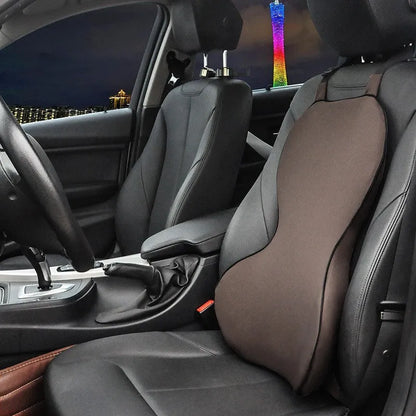Memory cotton car lumbar support cushion in grey, showing its contoured shape on a car seat.