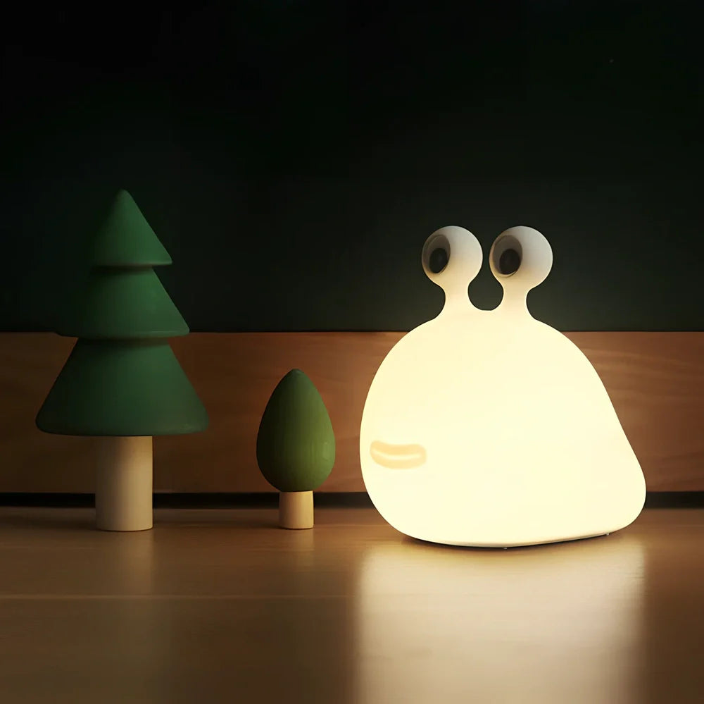 White cartoon slug night light with touch activation and USB power connection