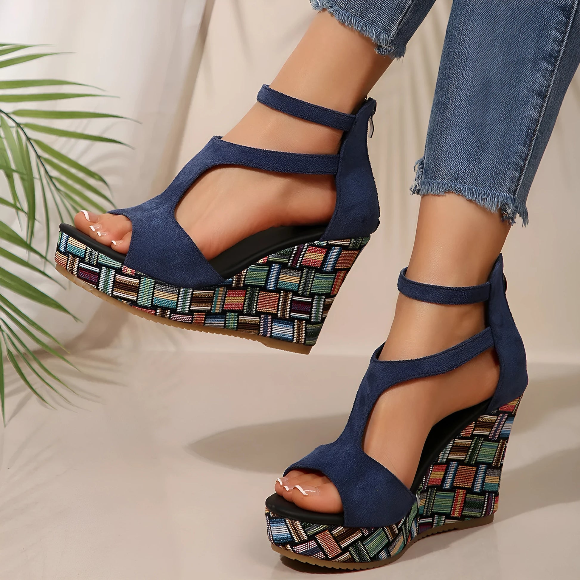 Women's thick-soled ankle-strap buckle sandals in cream white, showing cloth upper and rubber sole.